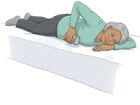 Rows on your stomach with a can, end position